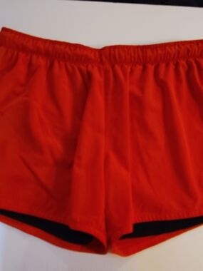 Nike Women s Athletic Shorts in Bright Orange with Black Trim